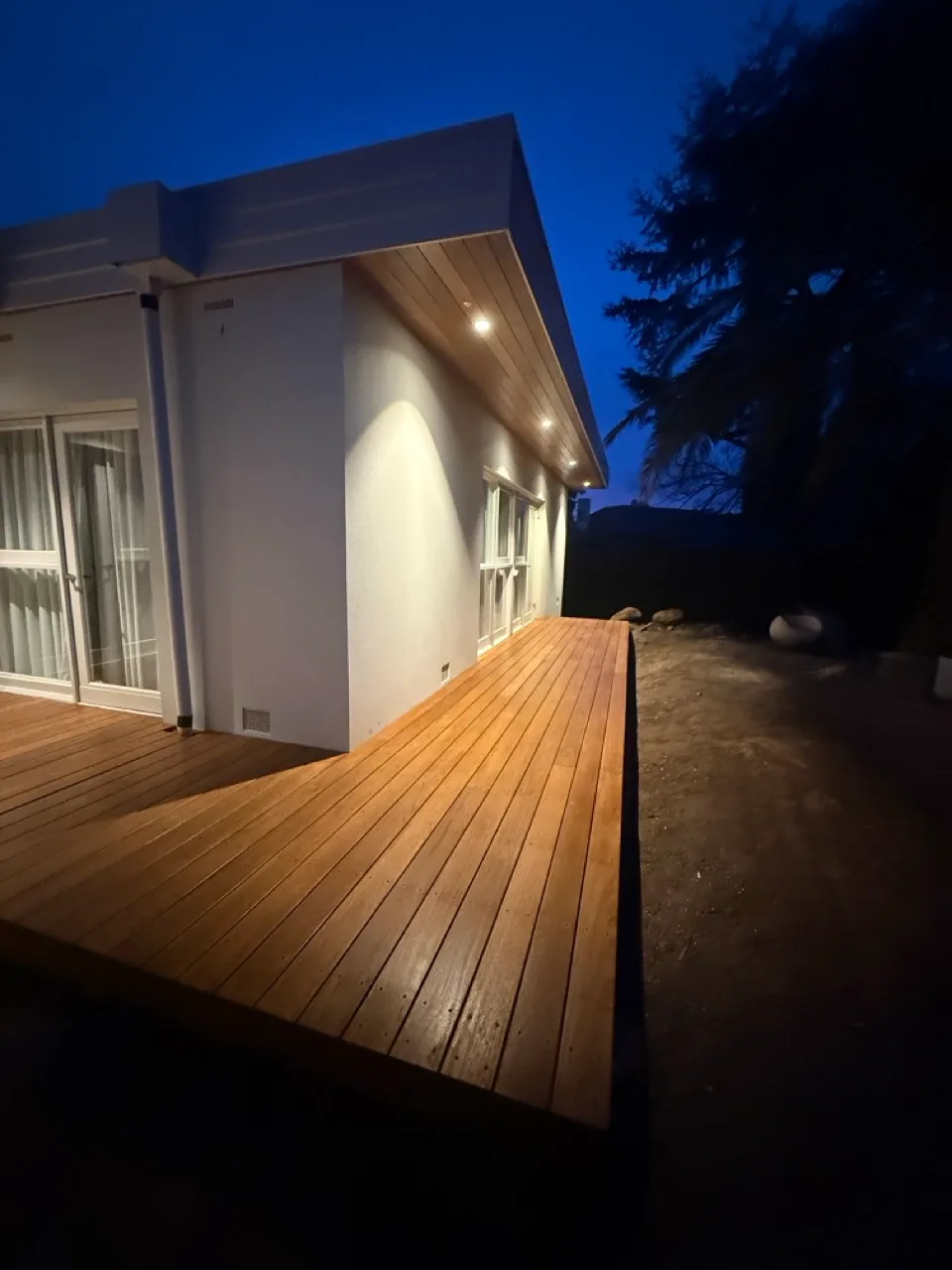 Timber-lined eave and deck at dusk